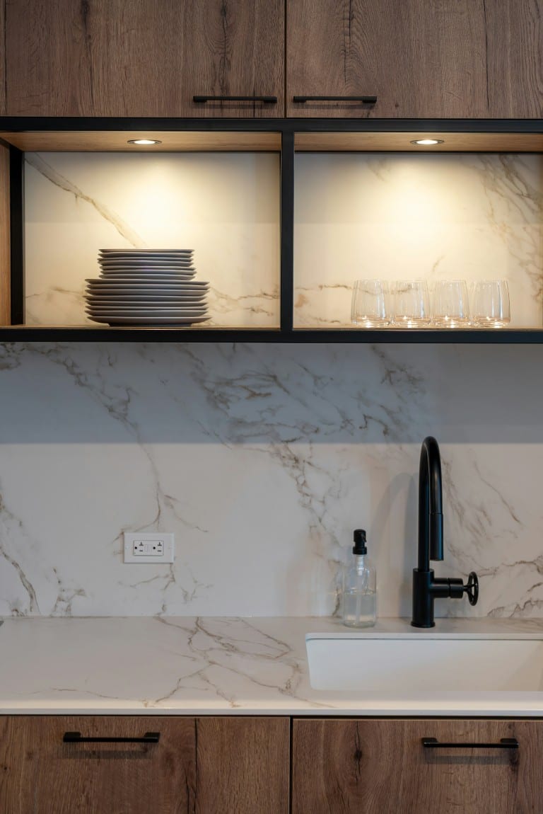 Walnut kitchen with marble backsplash detail